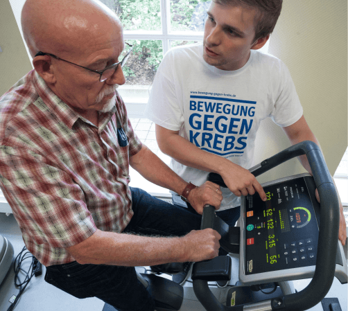 Men and women exercising with resistance bands in a modern gym