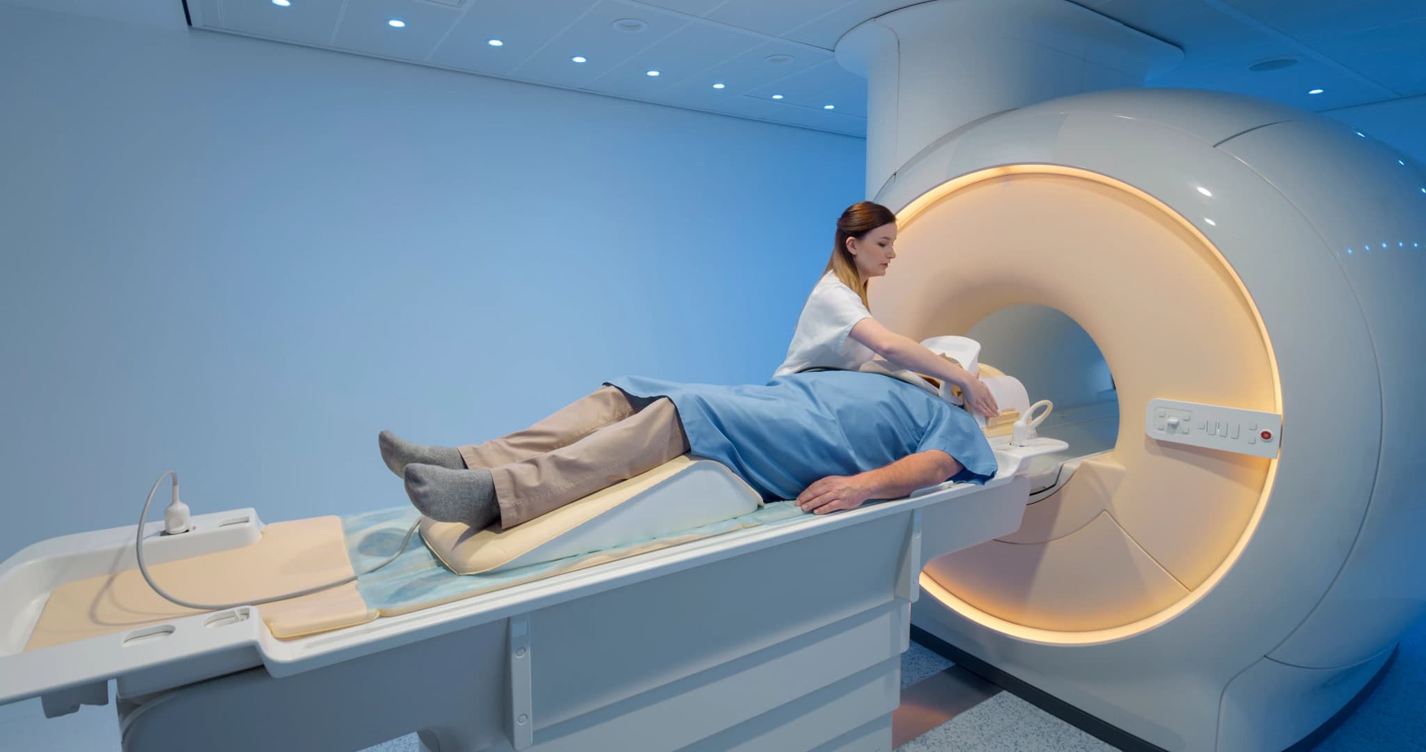 Healthcare professional analyzing brain MRI scan on computer screen in medical office