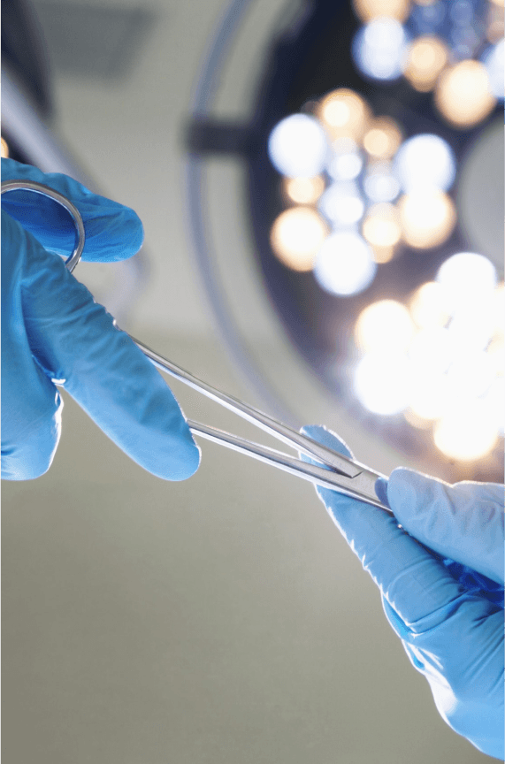 3D medical illustration showing a brain operation with surgical tools targeting a tumor